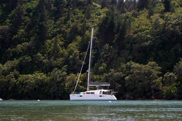 Yacht floating in river inlet 