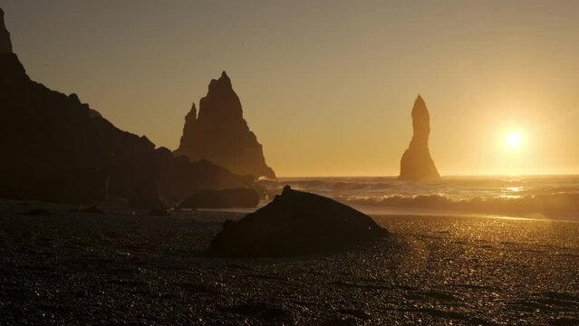 Black Volcanic Coastline In Iceland, Sunset over Black Sand Beach Vik, Famous Cliffside, Shot in 8K Resolution 4320p
