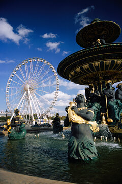 Fountain and Ferris Wheel in Place de la Concorde, Paris, France