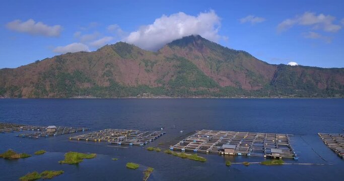 Aerial view at village near fish farming  on the lake under Batur volcano ,Bali island,Indonesia

