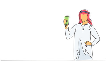 Continuous one line drawing portrait of happy young Arabian male holding glass of orange juice. Make him refreshing and enjoyment in summer season. Single line draw design vector graphic illustration