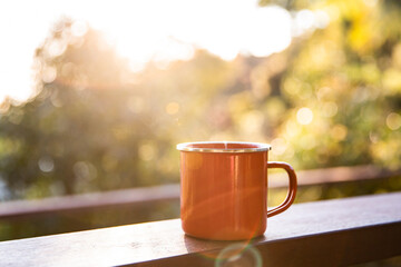 camping mug at sunrise