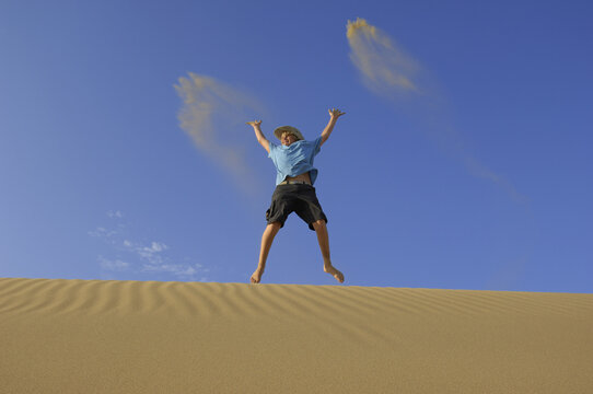 Boy Playing in Sand Dunes, Playa del Ingles, Cran Canaria, Canary Islands