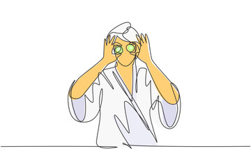 Single continuous line drawing young beautiful smiling woman with bathrobe holding cucumber slices on face. Skin care, spa and beauty treatments. Anti aging cosmetics. Dynamic one line draw graphic