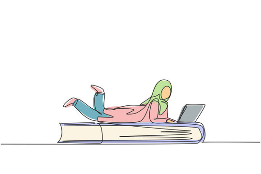 Continuous one line drawing young Arab female with laptop laying down on big book. Freelance, distance learning, online courses, studying concept. Single line draw design vector graphic illustration