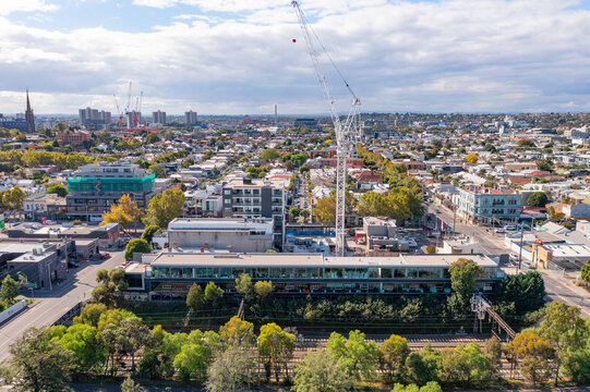 Aerial view of a city construction sight with a large crane