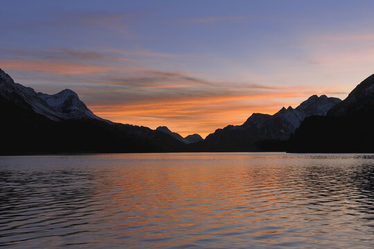 Sunset at Lake Sils with Piz Salacina, Monte Gruf, and Piz Lunghin, St Moritz, Engadin, Maloja District, Graubunden, Switzerland