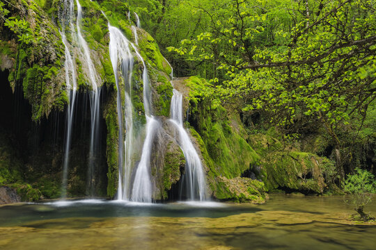 Waterfall cascading over green moss, Cascade des Tufs, Arbois, Jura, Jura Mountains, Franche-Comte, France