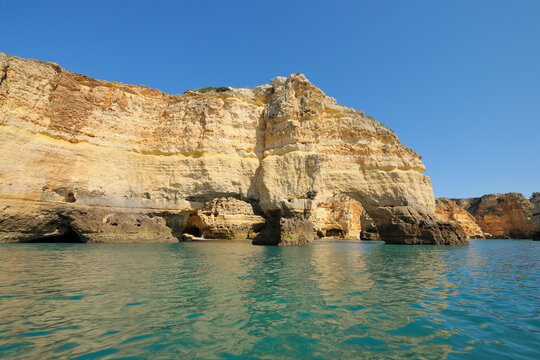 Atlantic Ocean and Cliffs with Natural Arches between Armacao de Pera and Portimao, Benagil, Lagoa, Portugal