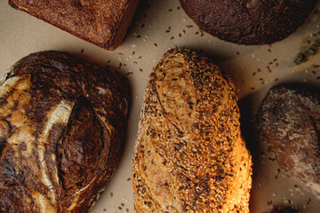 Various types of fresh craft bread with seeds.. Top view