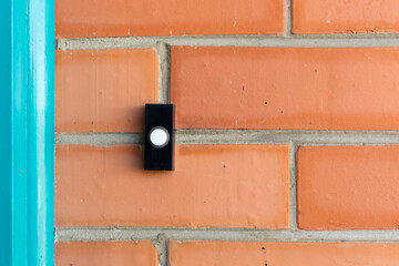 Doorbell on red brick house