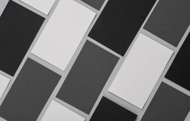 Many blank business cards for branding on a gray background. Mockup for presentations, corporate identity and portfolios of graphic designers