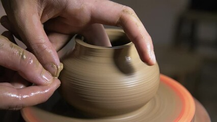 close up detail view of The process of making ceramic teapots, making mud by hand pottery on wheel