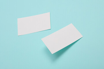 White Blank business card for corporate identity on blue background. Creative mockup.