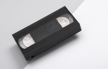 Retro video cassette on gray white background