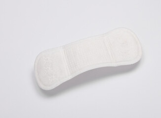 Hygienic feminine pads levitating on a white background