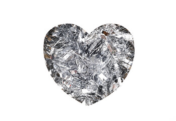 Heart cut out of paper hole with tinsel on white background