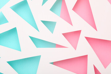 Cut paper in the shape of triangles. Abstract background