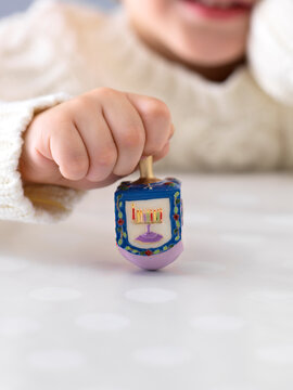 Boy Spinning Dreidel