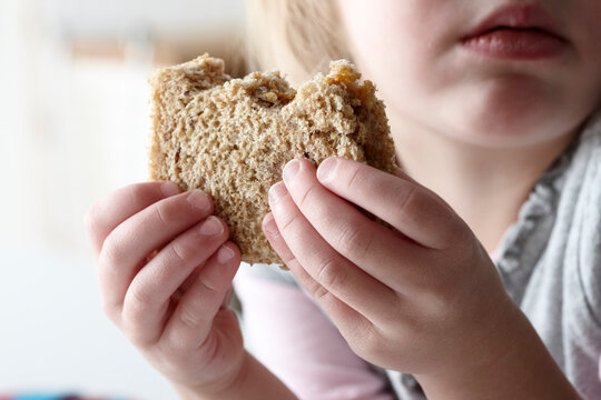 Girl Eating Peanut Butter Sandwich