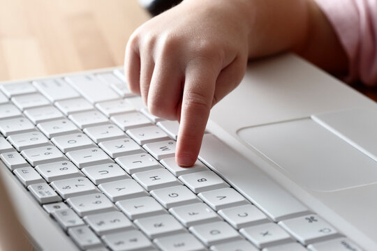 Girl's Hand on Keyboard