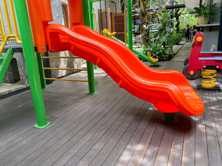 Colorful playground made of plastic empty outdoor playground set playground equipment.Garden equipment. Children's slide. School yard. Playground in the park.