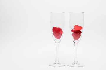 Two glasses with hearts on white background. Valentine's Day, February 14