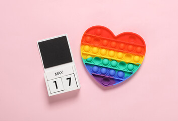 International day against homophobia. May 17 date calendar with rainbow pop it on pink background