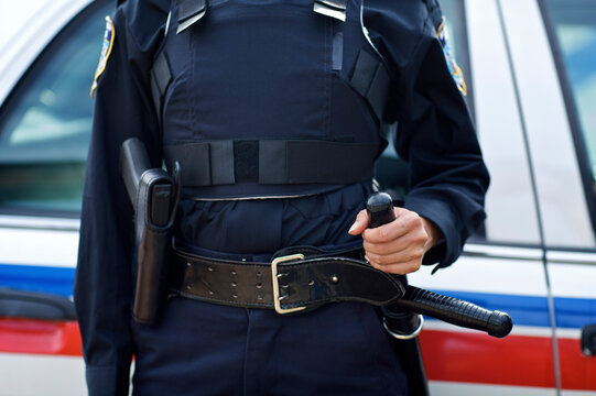 Close-up of Police Officer's Gun and Night Stick