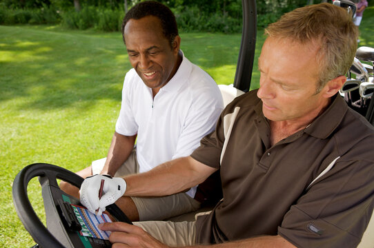 Golfers in Golf Cart with Scorecard, Burlington, Ontario, Canada