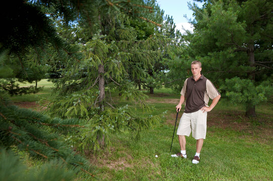 Man with Golf Ball in Rough, Burlington, Ontario, Canada