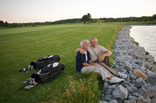 Couple Sitting by Pond on Golf Course, Burlington, Ontario, Canada