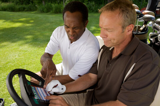 Golfers in Golf Cart with Scorecard, Burlington, Ontario, Canada