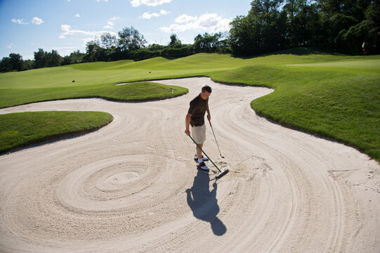 Man in Sand Trap, Burlington, Ontario, Canada