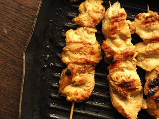 Top view chicken satay in grill skillet pan