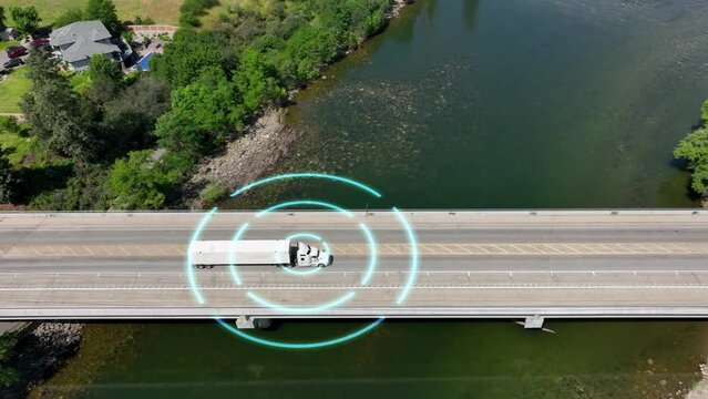 Self driving semi truck navigating a bridge to deliver its load.