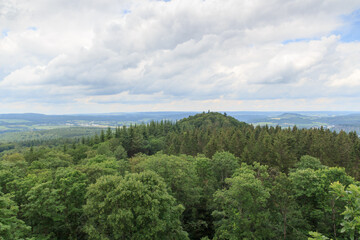 Fototapeta na wymiar Panorama view of Eifel mountains with trees seen from hill Heiligenstein near Gerolstein, Germany