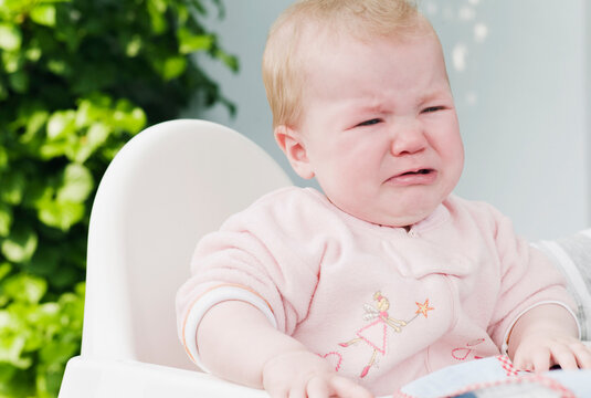 Crying Baby in High Chair