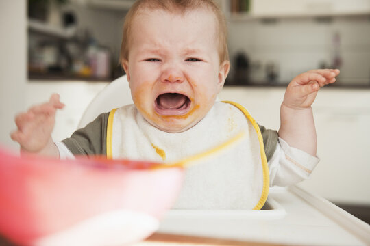 Crying Baby in High Chair