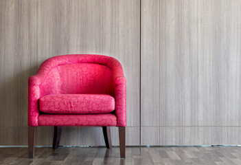 Red sofa on left of room decorated with copy space