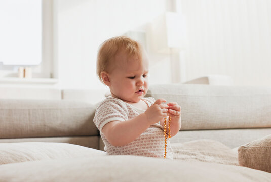 Baby Girl Playing with Beads