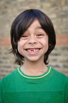 Portrait of Boy with Missing Tooth