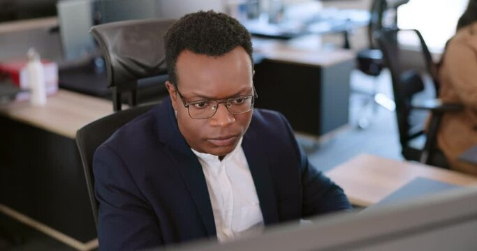 Developer, computer or programmer thinking of cyber security code for digital transformation on internet. Cloud computing, hacker or focused black man coding or programming software data at office