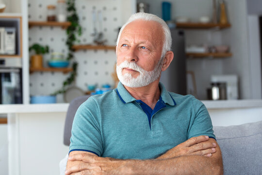 Bored tired sad mature man depressed lonely having no visitors of his children. Divorce , bachelor , health problems concept. Lockdown, unemployment, needless man on social distance