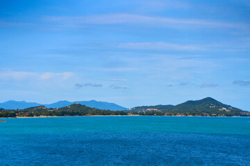 Fototapeta premium A seascape with turquoise water and islands in the distance. Winter vacation in Thailand