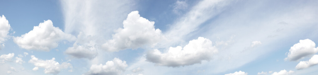 Panoramic photo of blurred sky. Blue sky background with cumulus clouds