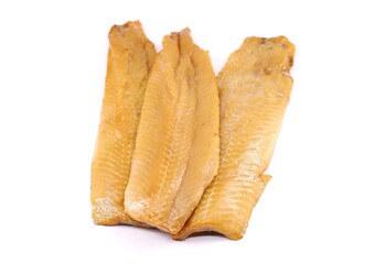 Fillets of smoked herrings on white background.