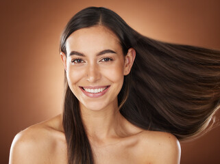Face portrait, hair care and beauty of woman in studio isolated on a brown background. Wellness,...