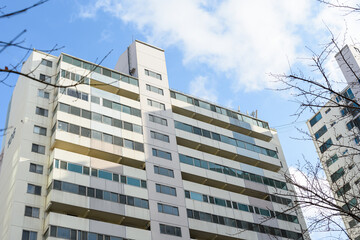 A tall apartment that is generally inhabited by Koreans