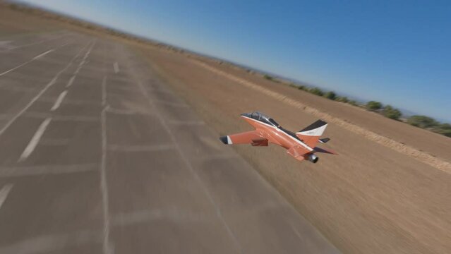 FPV drone tracking RC plane flying in sunny day. Aerial